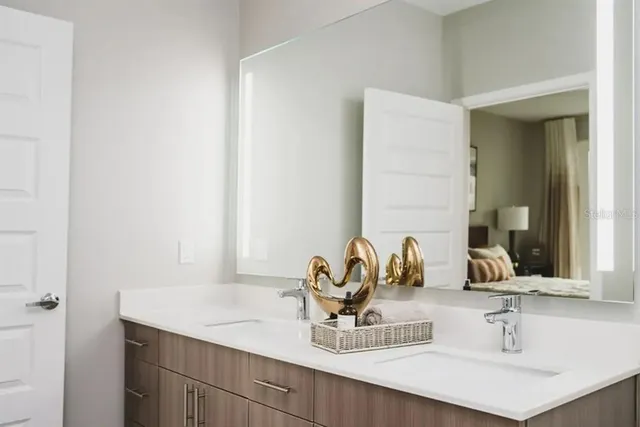 a bathroom with a sink and a mirror