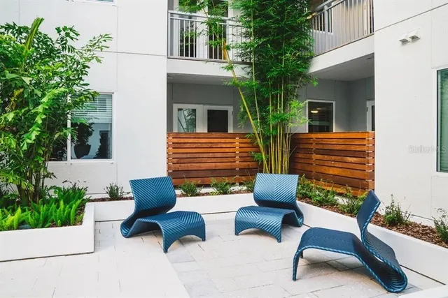 a view of a building with sitting area