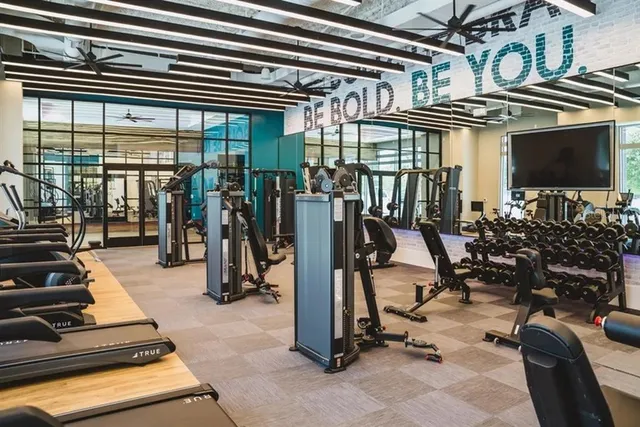 a kitchen with a stove a sink and a microwave