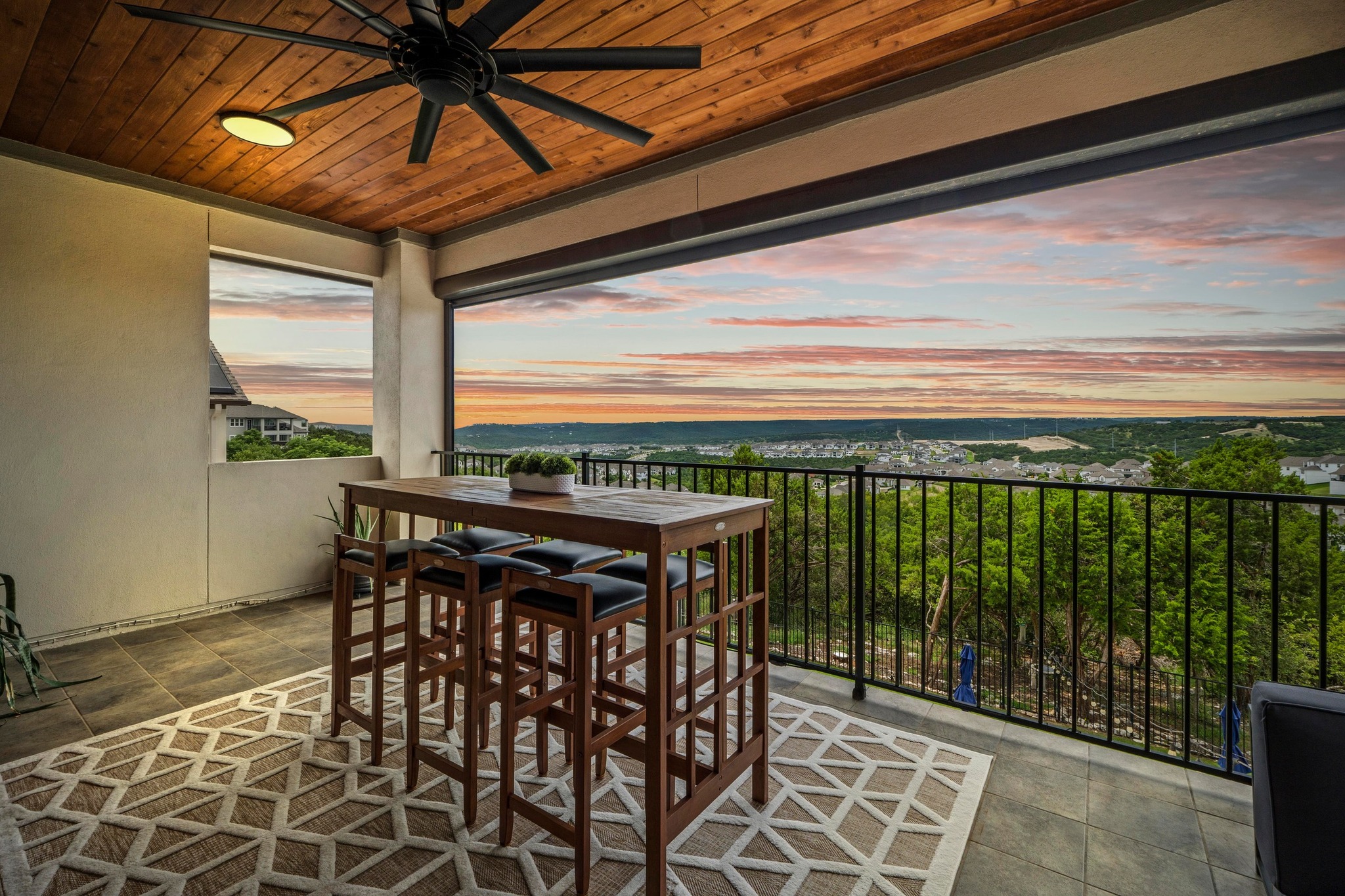 1329 Siena Sunset Road Leander, TX 78641 - Photo 3 of 33 Upper balcony at dusk offering a panoramic hill country view.