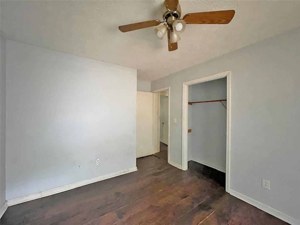 40 Judy Court Stockbridge, GA 30281 - Photo 12 of 14 an empty room with a empty space and a ceiling fan