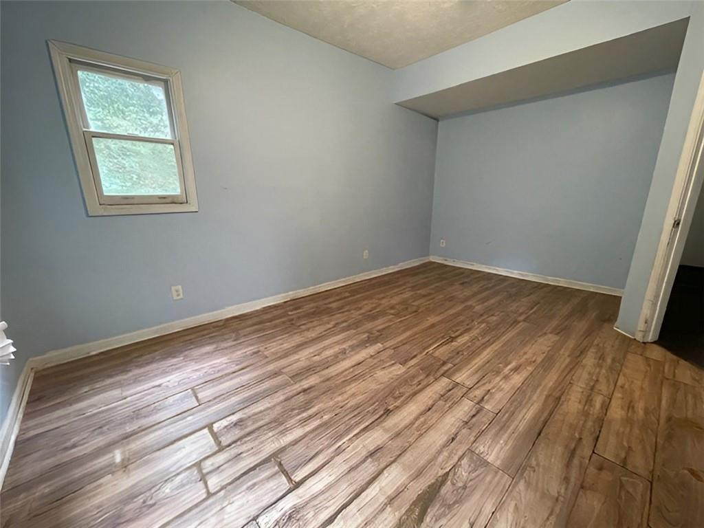 40 Judy Court Stockbridge, GA 30281 - Photo 2 of 14 a view of empty room with wooden floor