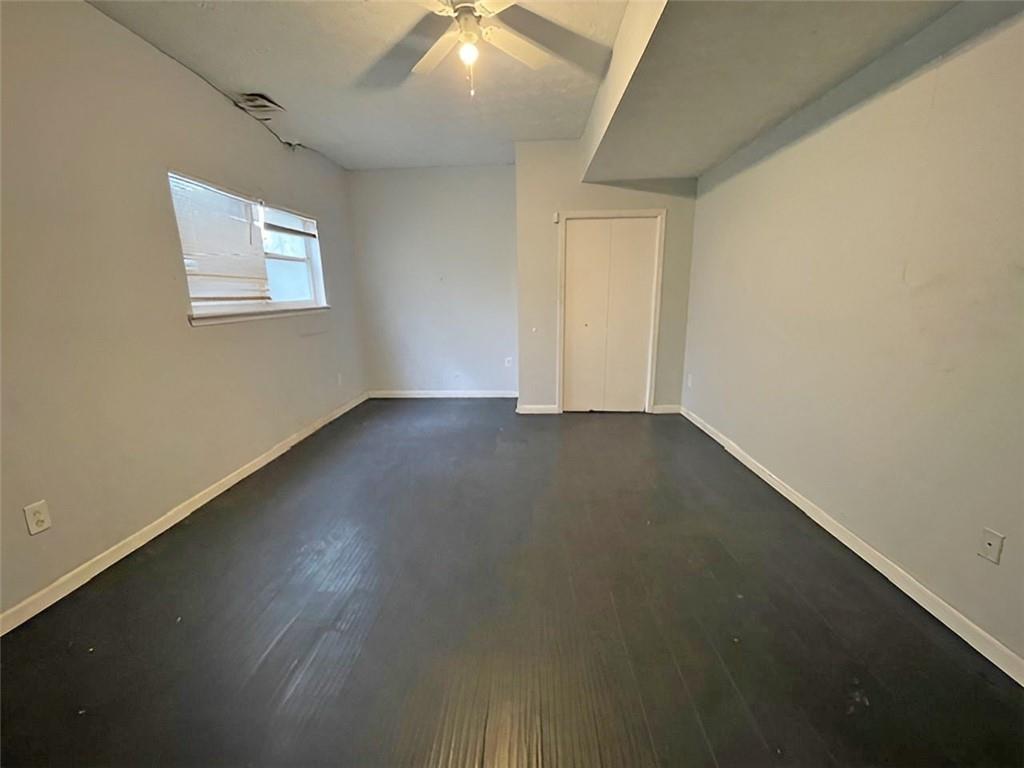 40 Judy Court Stockbridge, GA 30281 - Photo 5 of 14 an empty room with wooden floor and windows