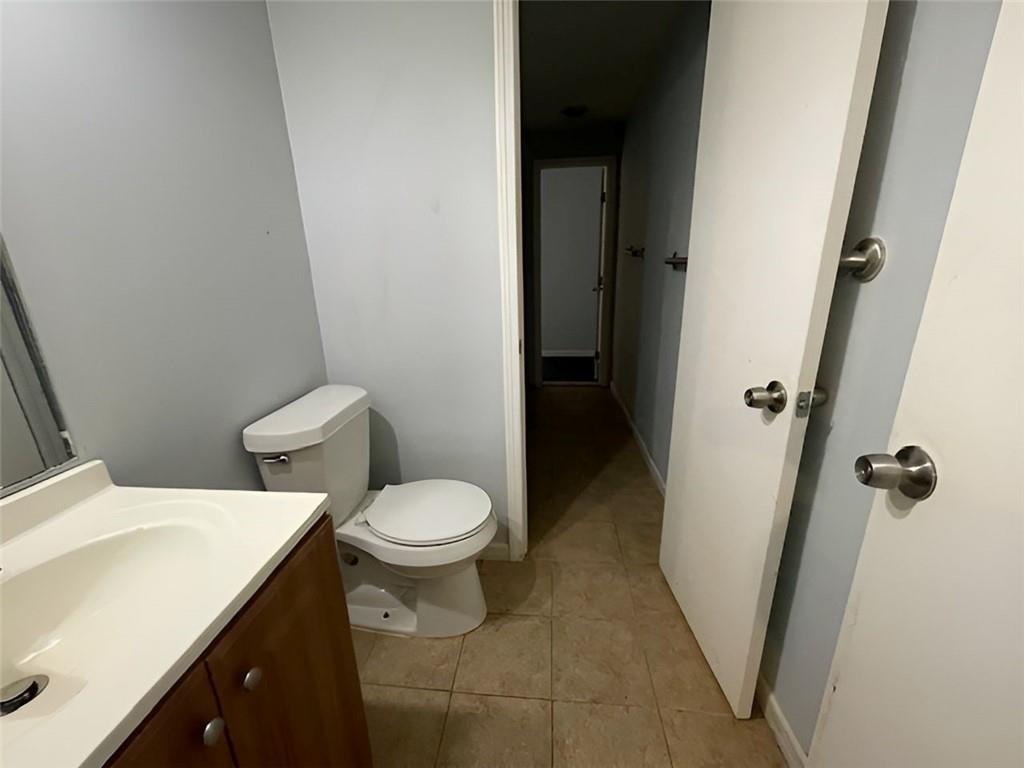 40 Judy Court Stockbridge, GA 30281 - Photo 6 of 14 a white toilet sitting next to a sink