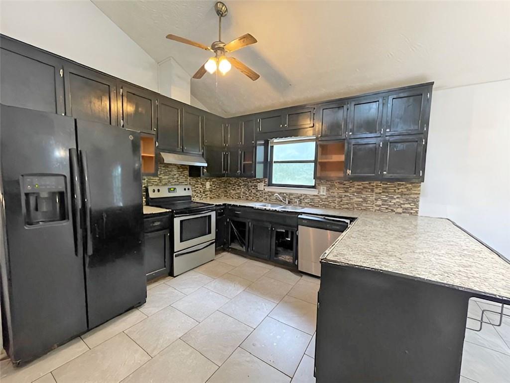 40 Judy Court Stockbridge, GA 30281 - Photo 10 of 14 a kitchen with a refrigerator sink and cabinets