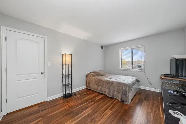 a bedroom with two beds and a tv