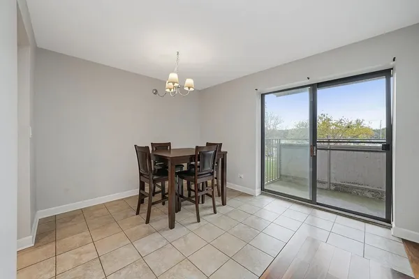 a view of a dining room with furniture wooden floor and chandelier