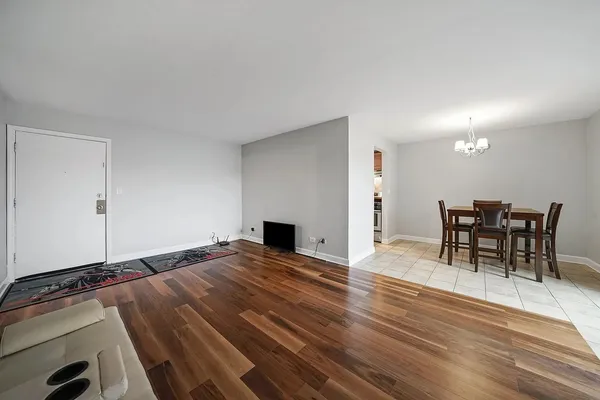 a view of a livingroom with furniture and wooden floor