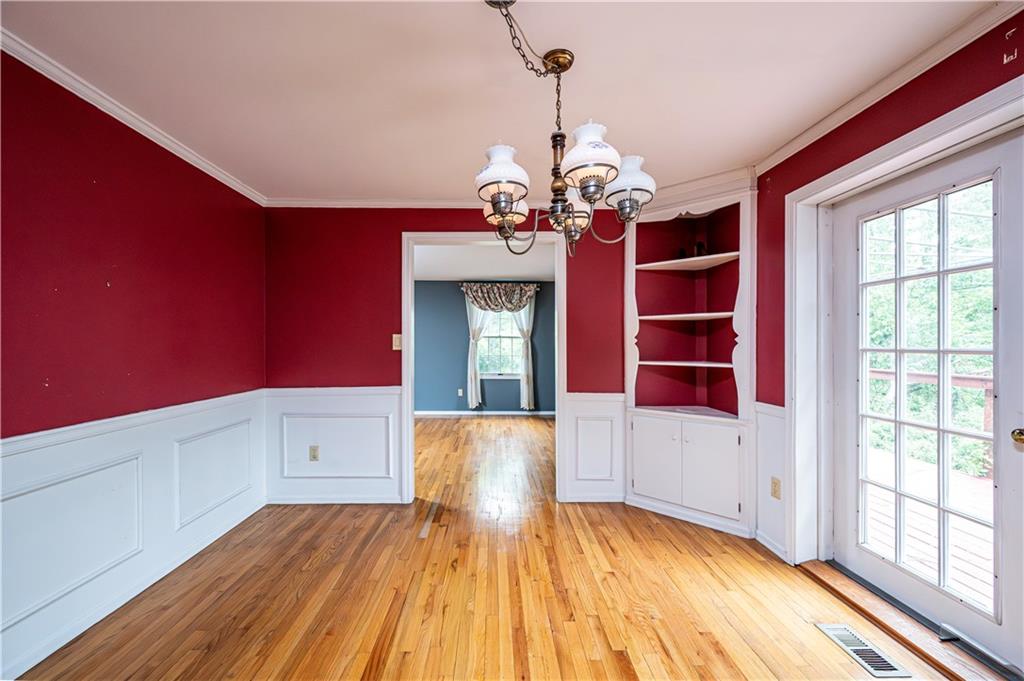 3221 Attleboro Road Greensburg, PA 15601 - Photo 12 of 38 a view of a room with wooden floors and chandelier