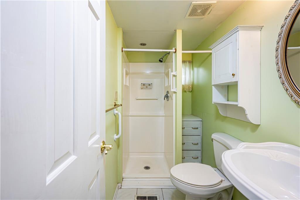 3221 Attleboro Road Greensburg, PA 15601 - Photo 16 of 38 a bathroom with a toilet a sink and a mirror