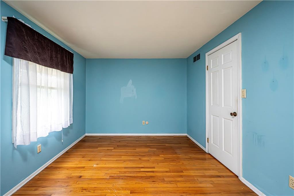 3221 Attleboro Road Greensburg, PA 15601 - Photo 25 of 38 a view of room with window and wooden floor