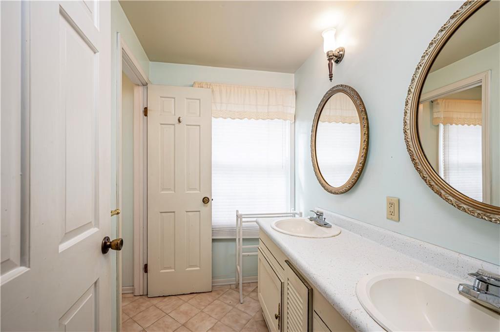 3221 Attleboro Road Greensburg, PA 15601 - Photo 28 of 38 a bathroom with a sink and a mirror