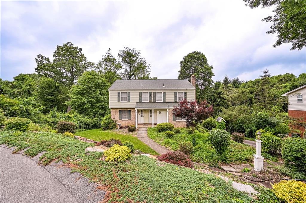 3221 Attleboro Road Greensburg, PA 15601 - Photo 37 of 38 a view of a house with a yard and a garden