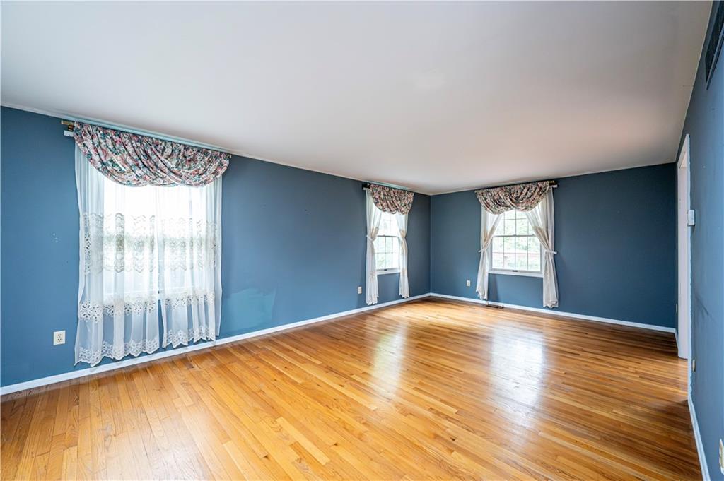 3221 Attleboro Road Greensburg, PA 15601 - Photo 5 of 38 a view of empty room with wooden floor and fan