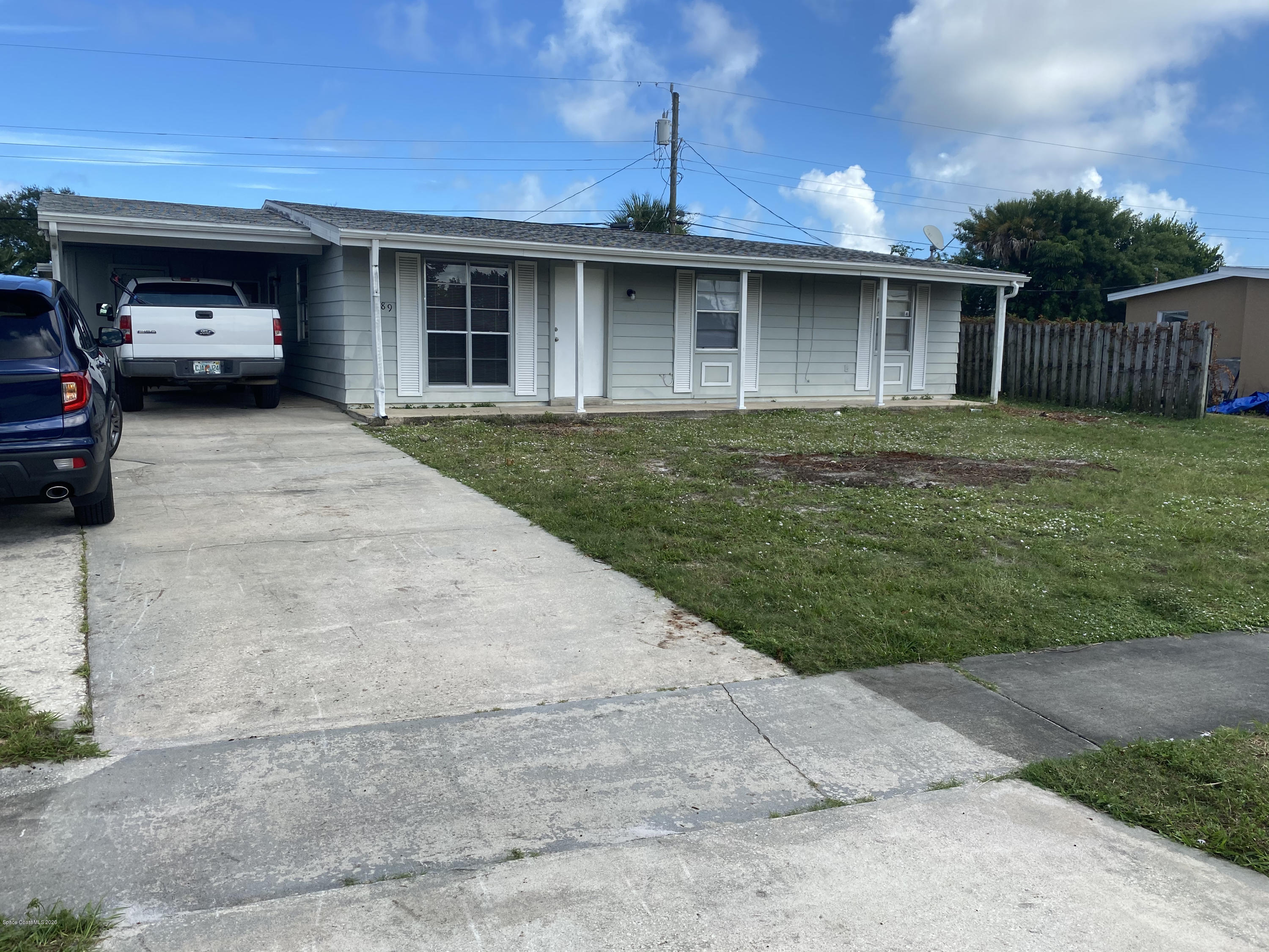 a view of a car parked in front of a house
