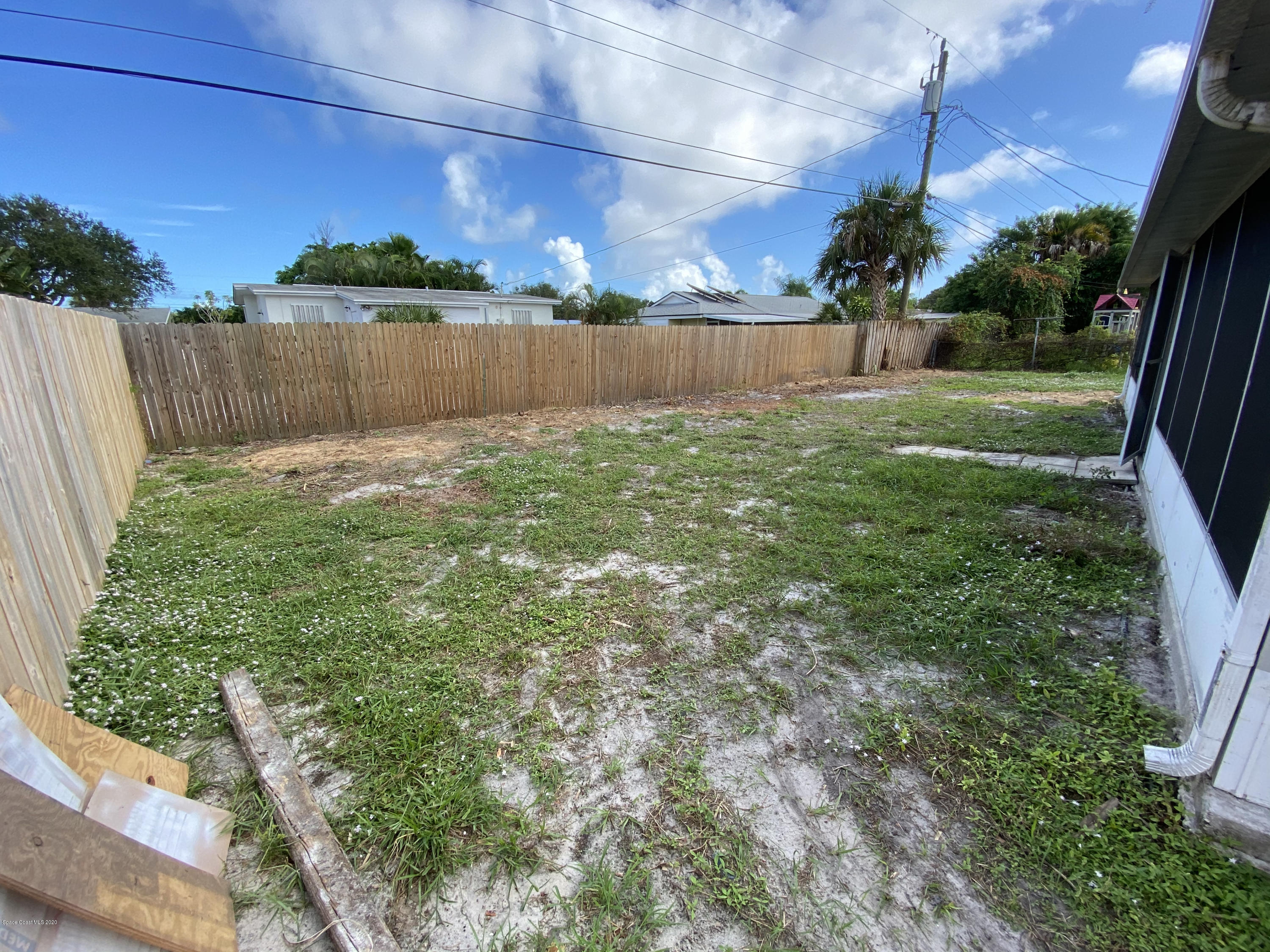 889 Bianca Drive Northeast Palm Bay, FL 32905 - Photo 11 of 12 a view of a backyard
