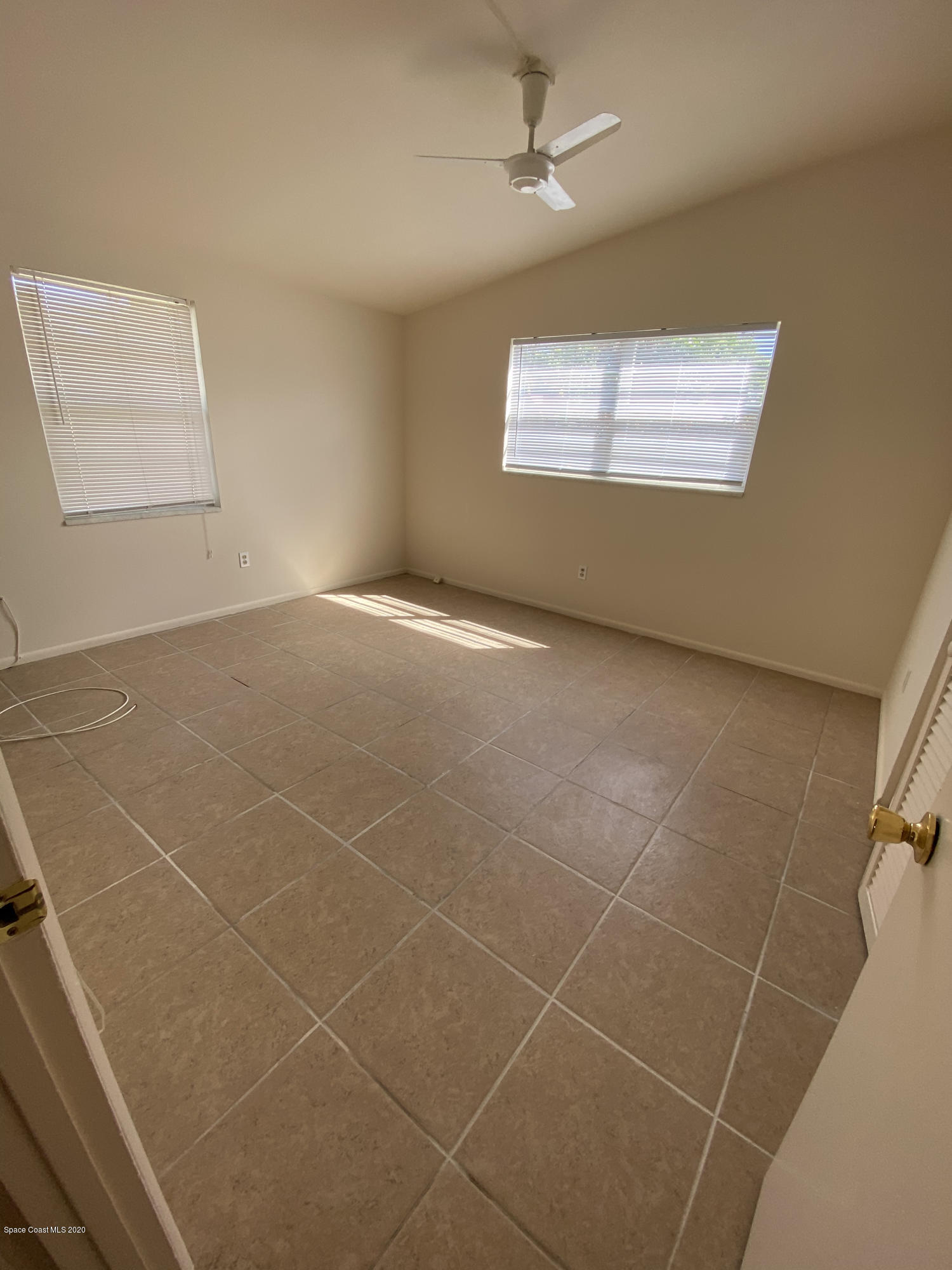 889 Bianca Drive Northeast Palm Bay, FL 32905 - Photo 6 of 12 a view of an empty room with a window