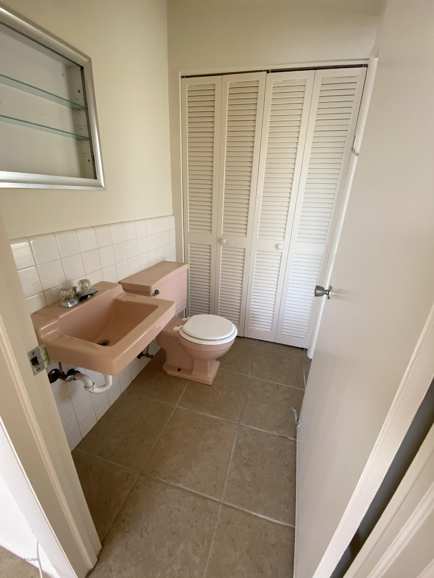 889 Bianca Drive Northeast Palm Bay, FL 32905 - Photo 7 of 12 a bathroom with a sink and a toilet