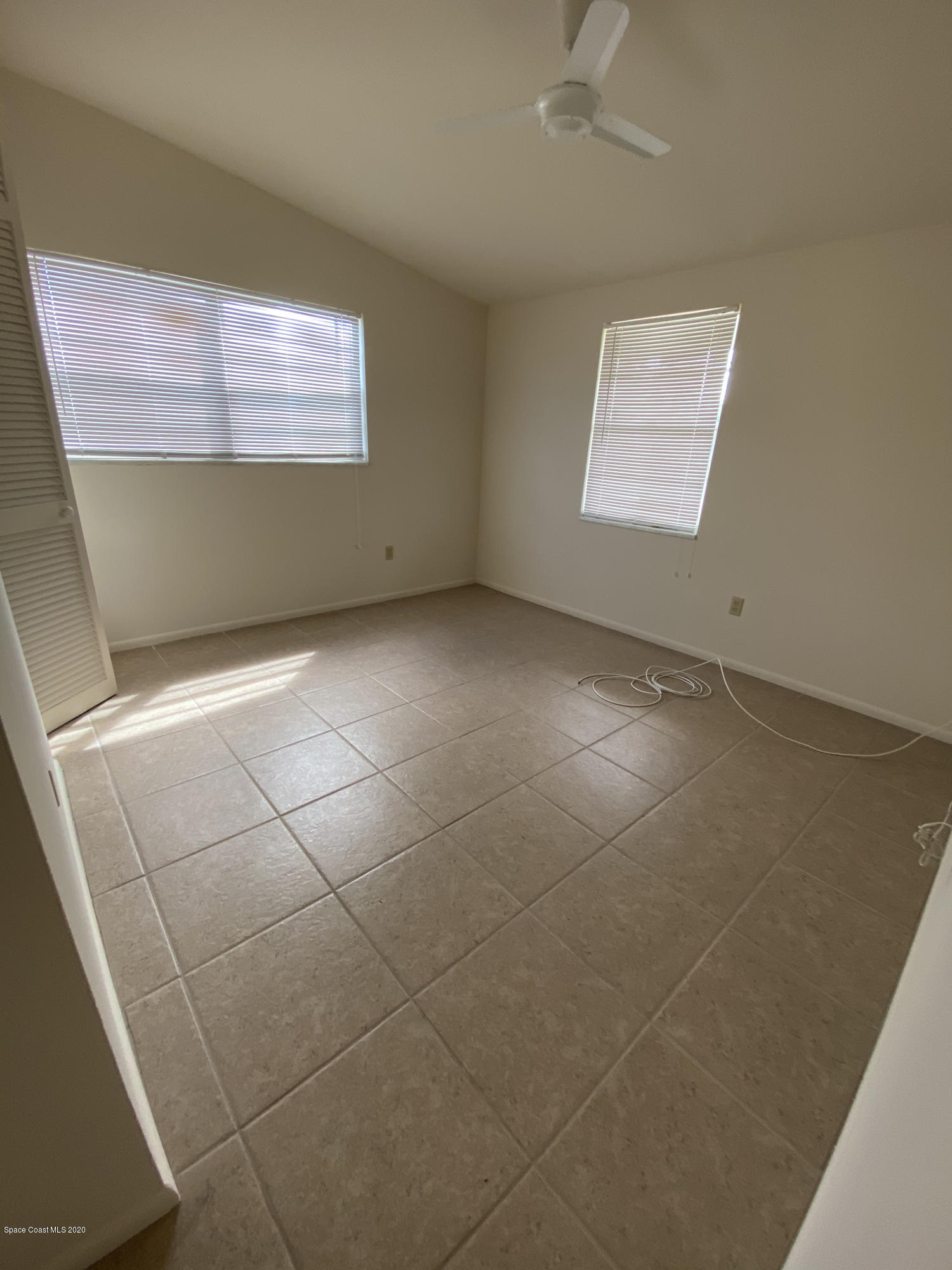 889 Bianca Drive Northeast Palm Bay, FL 32905 - Photo 8 of 12 a view of an empty room with a window