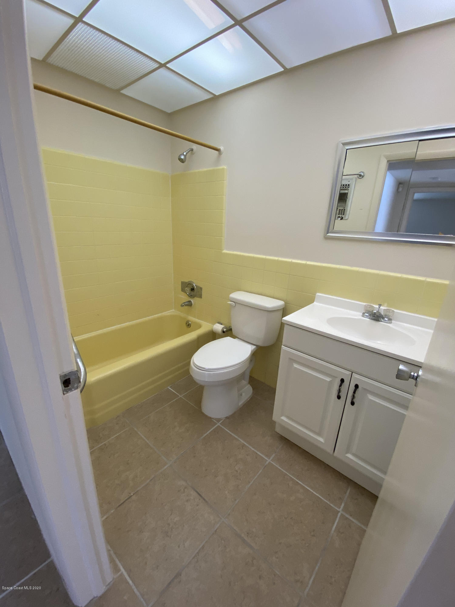 889 Bianca Drive Northeast Palm Bay, FL 32905 - Photo 9 of 12 a bathroom with a sink a toilet and shower