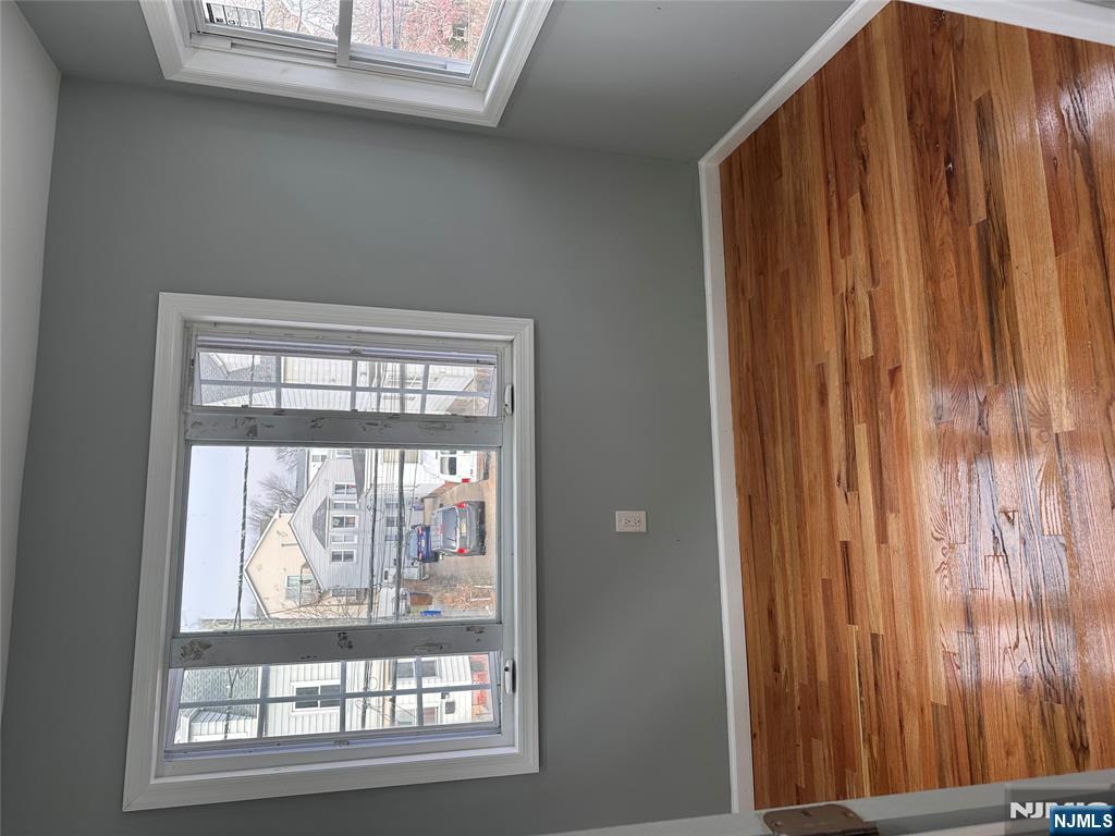 22 Knickerbocker Avenue Paterson, NJ 07503 - Photo 8 of 10 a view of a room with wooden floor and window