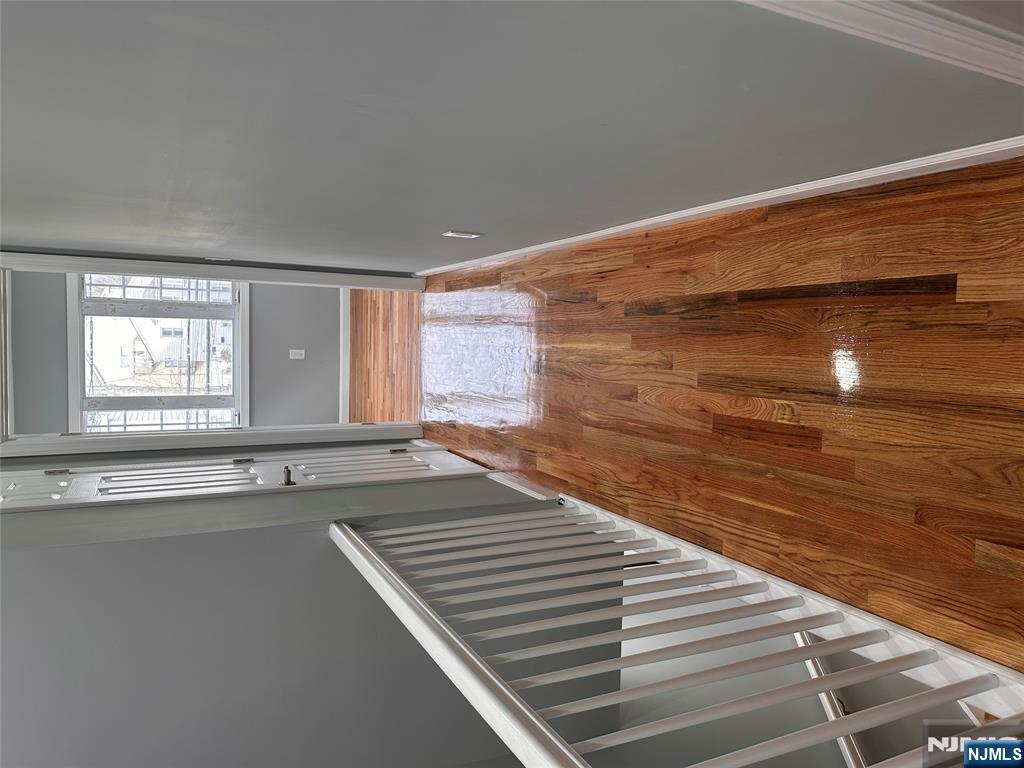 22 Knickerbocker Avenue Paterson, NJ 07503 - Photo 9 of 10 a view of balcony with wooden floor