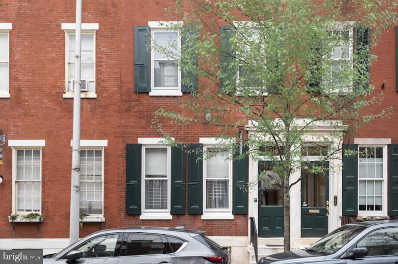 1316 Pine Street, Unit 3R Philadelphia, PA 19107 - Photo 2 of 12 a front view of a building with street view