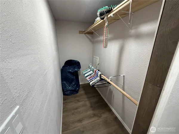 a view of room with window and hardwood floor
