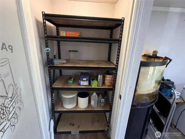 a kitchen with stainless steel appliances granite countertop a refrigerator a stove top oven a sink and dishwasher