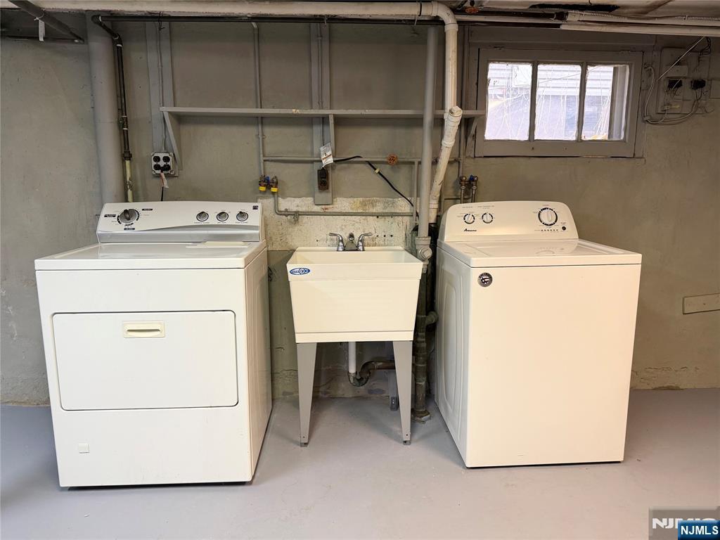 140 Westervelt Avenue, Unit 1 Hawthorne, NJ 07506 - Photo 17 of 20 a utility room with dryer and washer