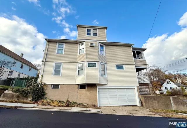 a front view of a house with stairs