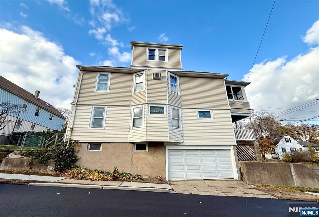 140 Westervelt Avenue, Unit 1 Hawthorne, NJ 07506 - Photo 18 of 20 a front view of a house with a yard