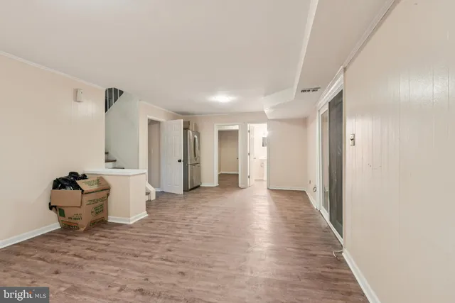 a view of a room with wooden floor and stairs