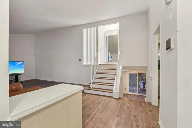 a view of entryway with wooden floor