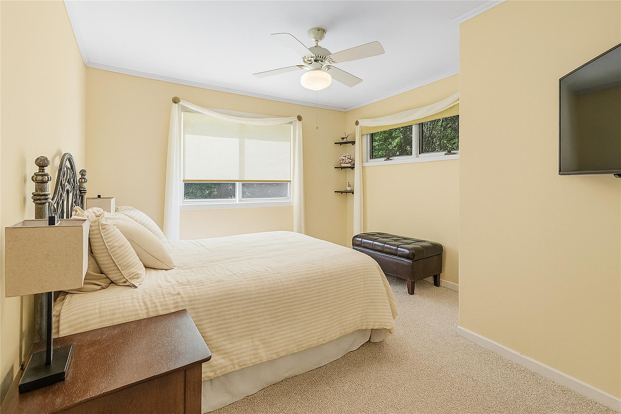 60 Quogue Riverhead Road Quogue, NY 11959 - Photo 14 of 20 a bedroom with a bed and wooden floor