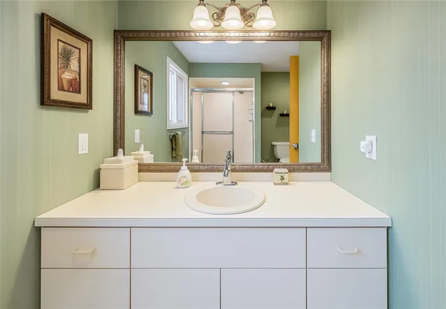 a bathroom with a sink and a mirror