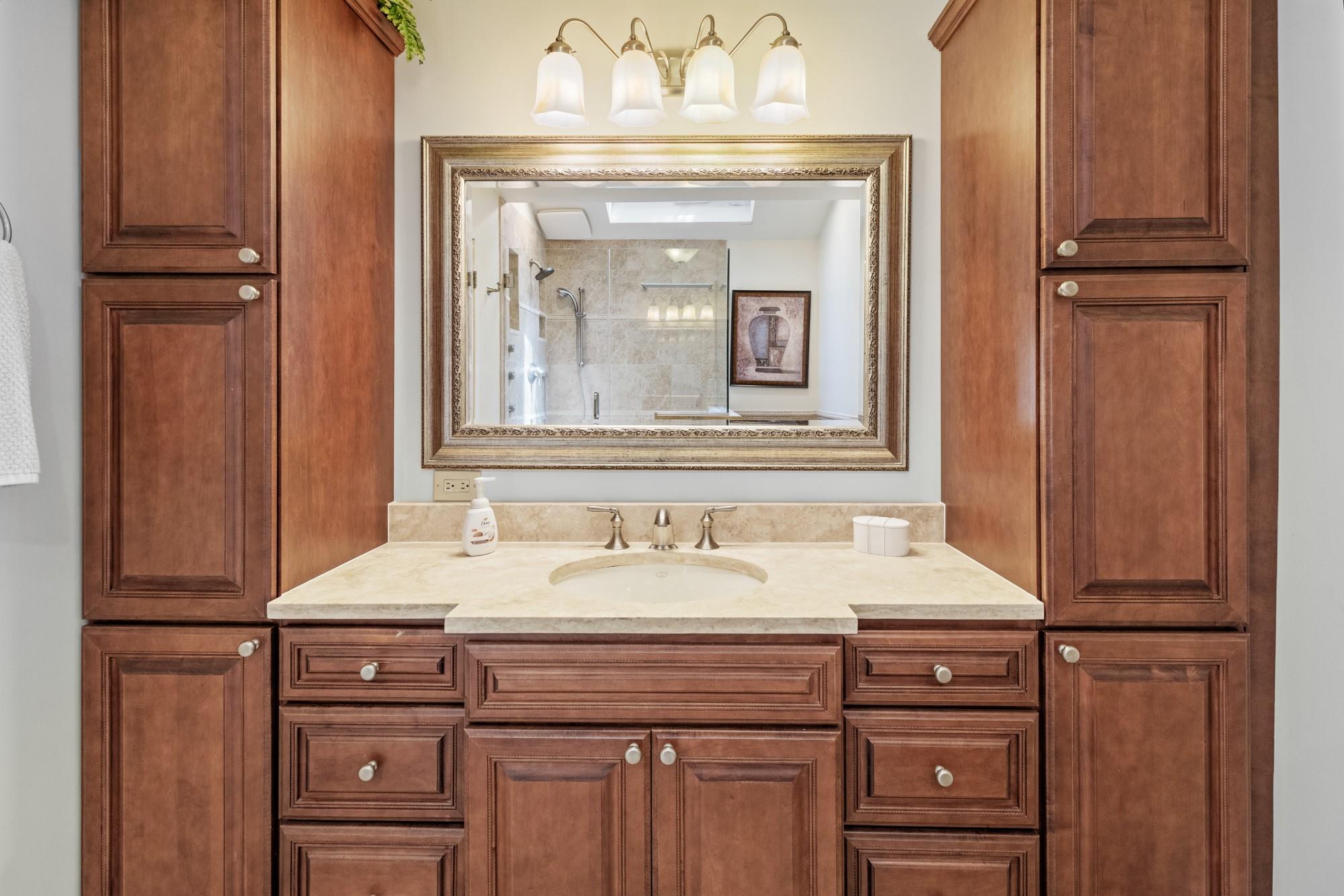 60 Quogue Riverhead Road Quogue, NY 11959 - Photo 18 of 20 a bathroom with a sink and a mirror