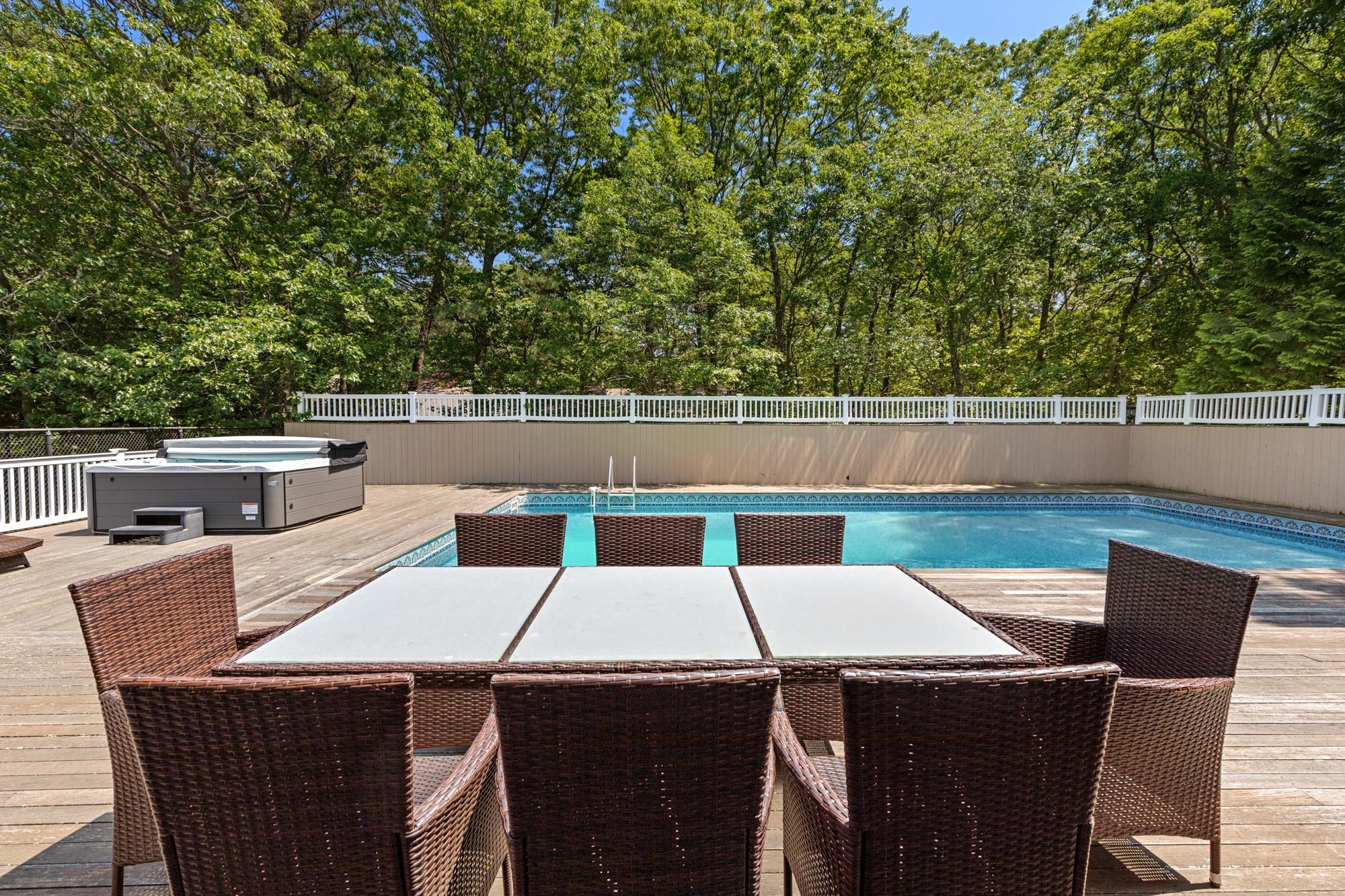 60 Quogue Riverhead Road Quogue, NY 11959 - Photo 19 of 20 a terrace with a table and chairs