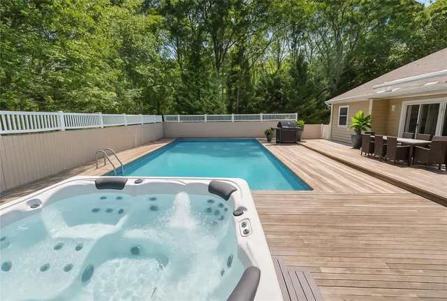 a view of a swimming pool with a patio