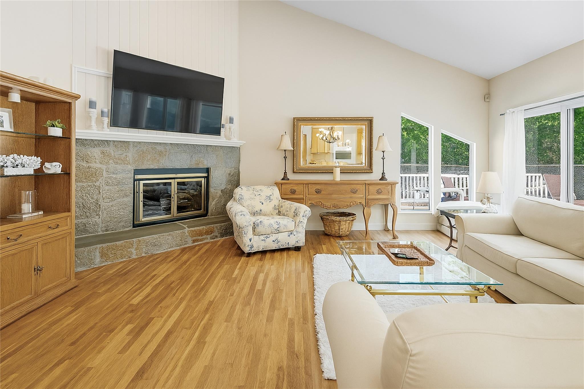 60 Quogue Riverhead Road Quogue, NY 11959 - Photo 5 of 20 a living room with furniture and a fireplace
