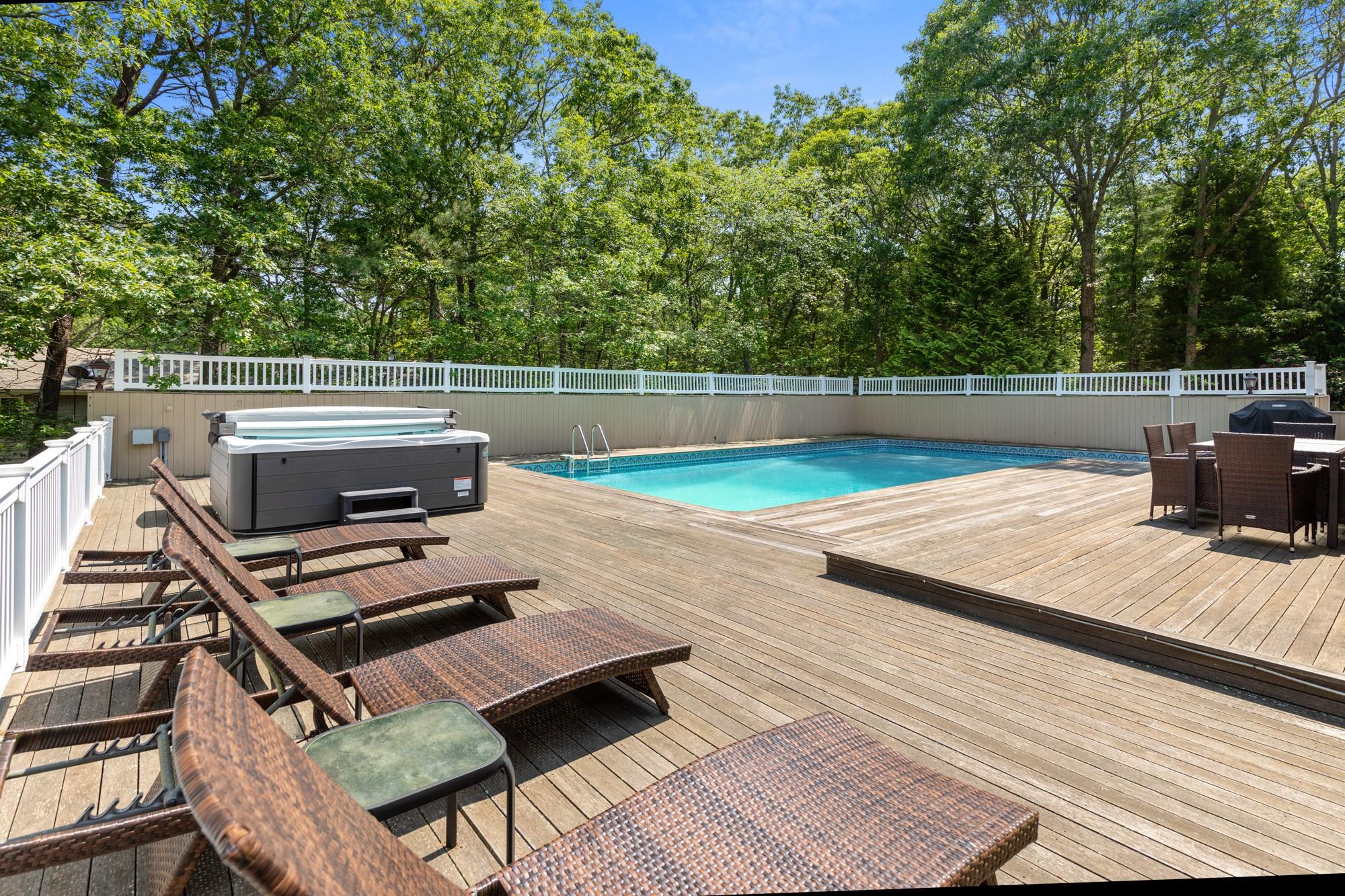 60 Quogue Riverhead Road Quogue, NY 11959 - Photo 9 of 20 a view of a balcony with wooden floor