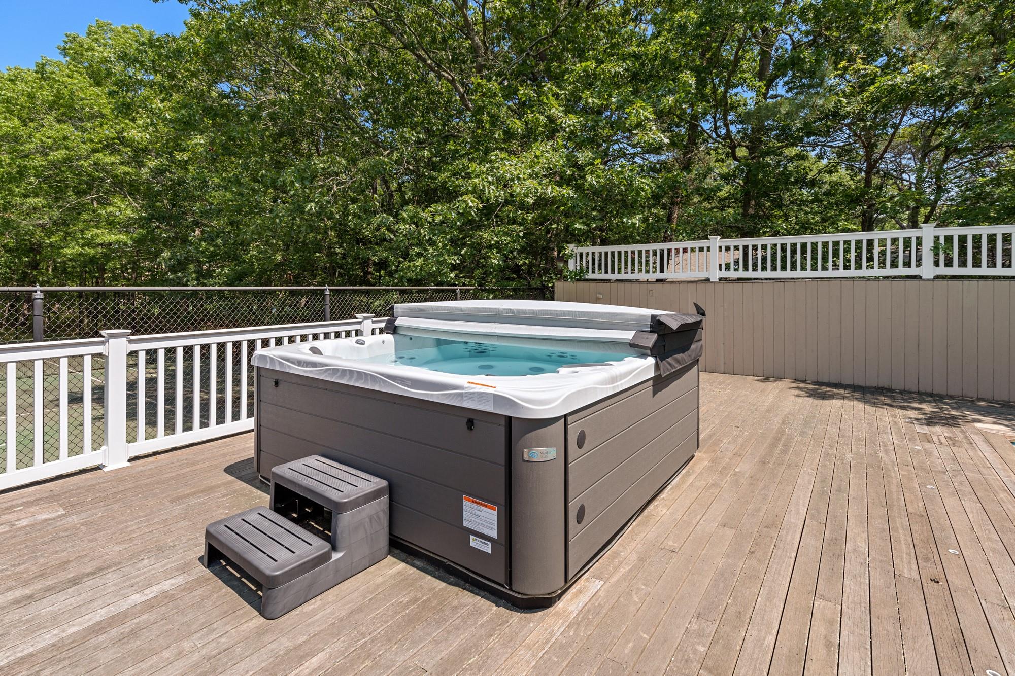 60 Quogue Riverhead Road Quogue, NY 11959 - Photo 10 of 20 a view of barbeque grill with wooden floor