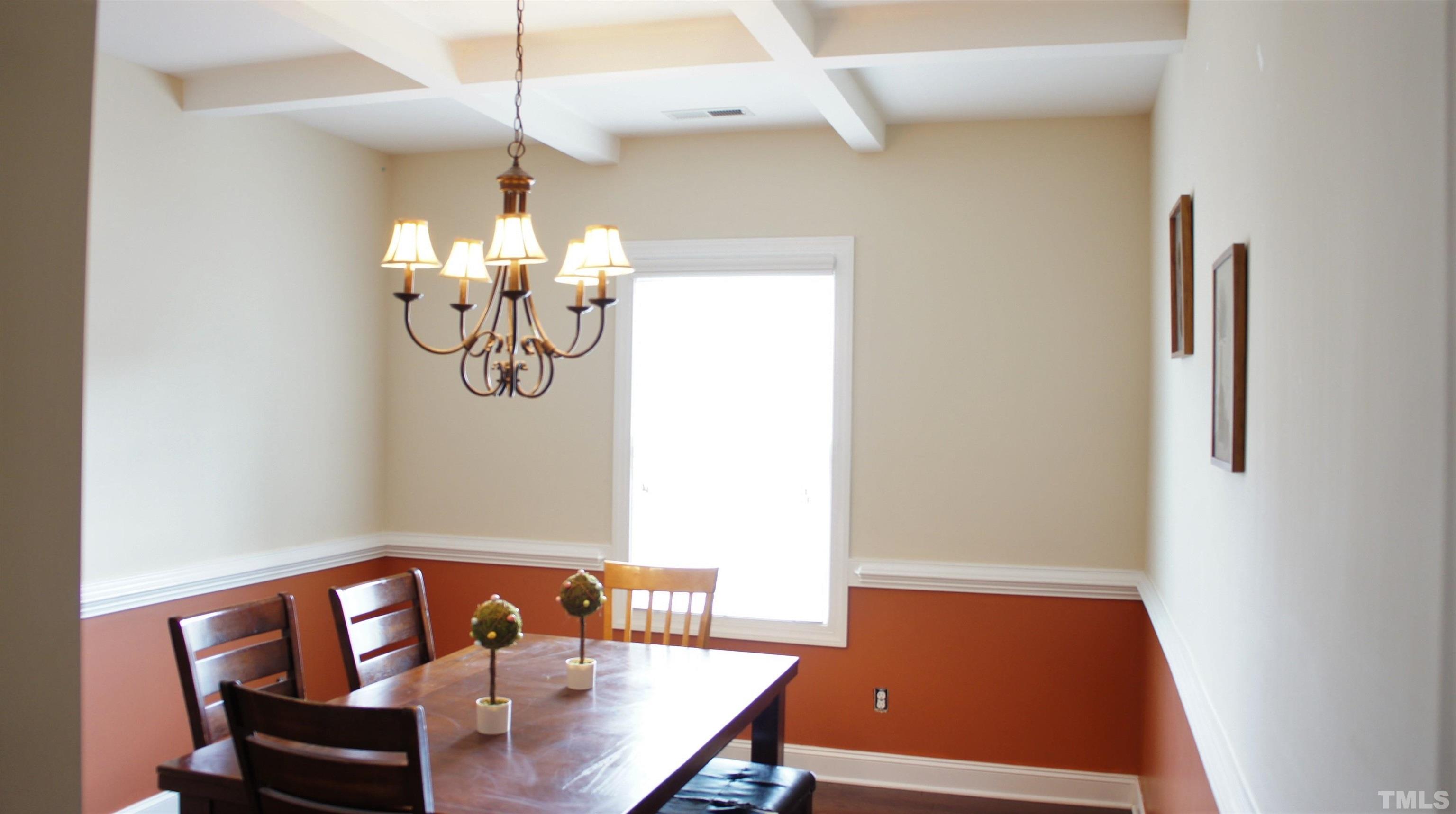4417 Glengrove Road Raleigh, NC 27616 - Photo 7 of 42 a view of a dining room with furniture and wooden floor