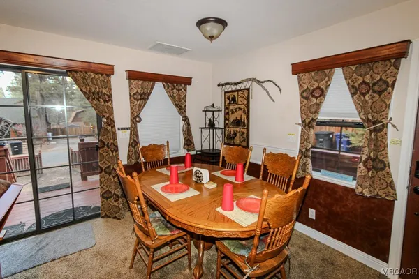 a kitchen with stainless steel appliances a refrigerator sink and white cabinets