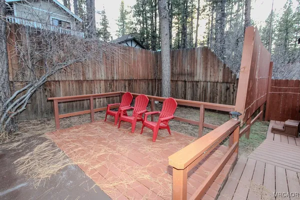 a view of deck with wooden floor and outdoor seating