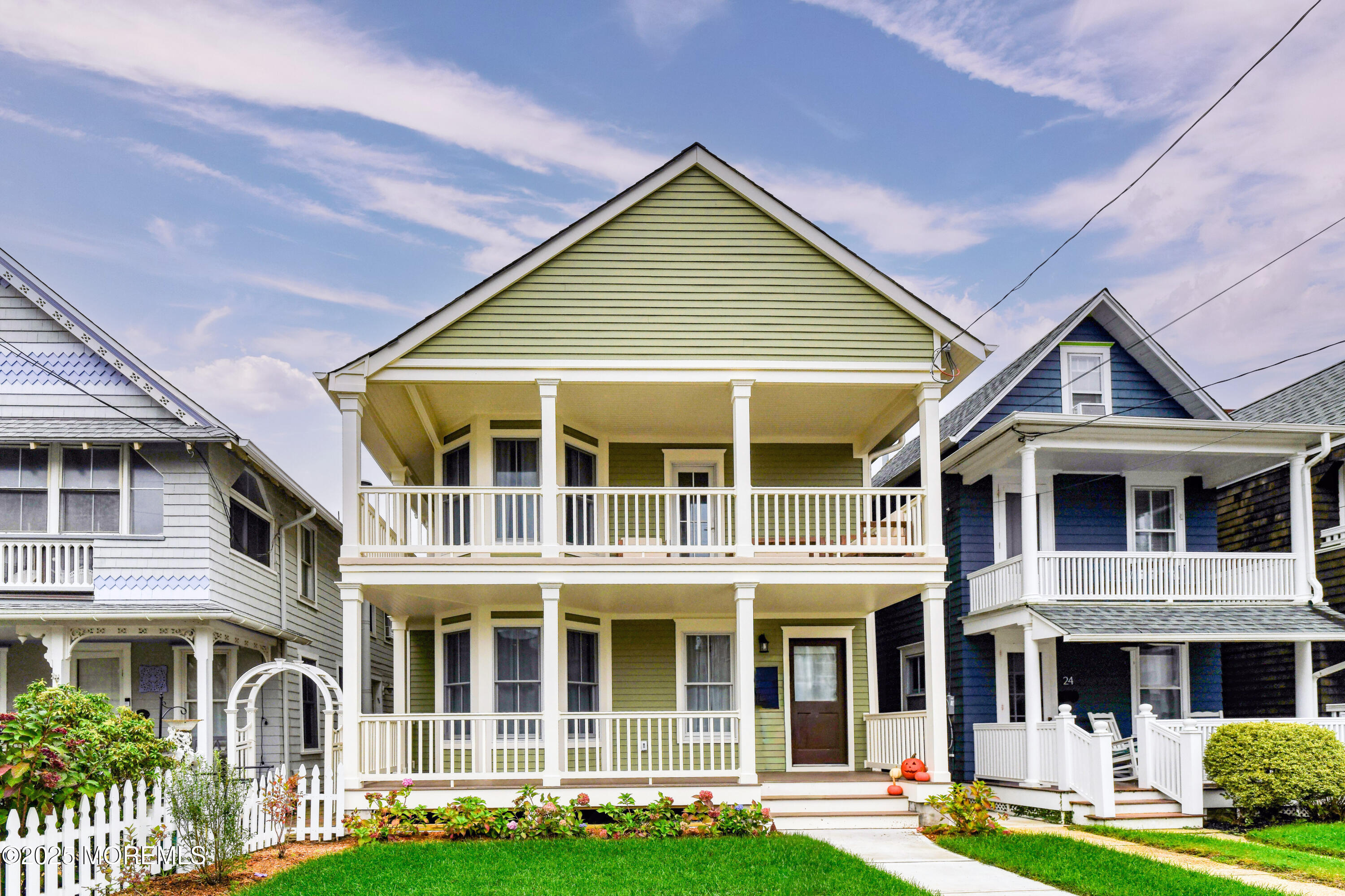 a front view of residential houses with yard