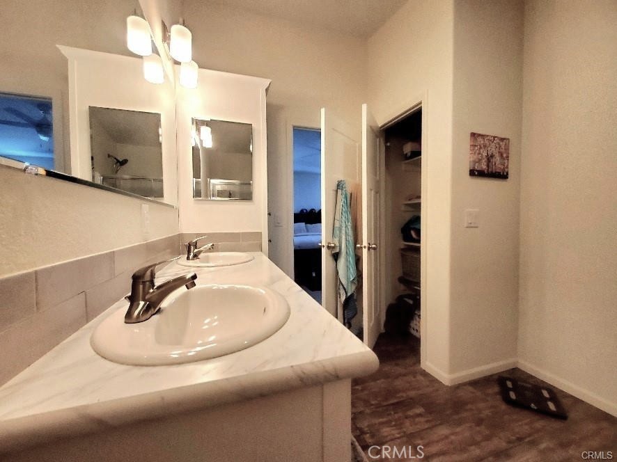 21621 Sandia Road, Unit 130 Apple Valley, CA 92308 - Photo 19 of 45 a bathroom with a sink and a mirror