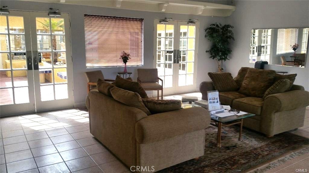 21621 Sandia Road, Unit 130 Apple Valley, CA 92308 - Photo 42 of 45 a living room with furniture and a large window