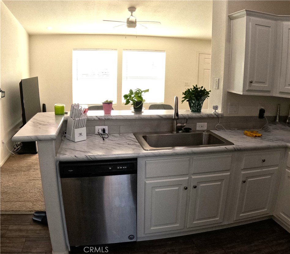 21621 Sandia Road, Unit 130 Apple Valley, CA 92308 - Photo 9 of 45 a sink with a window