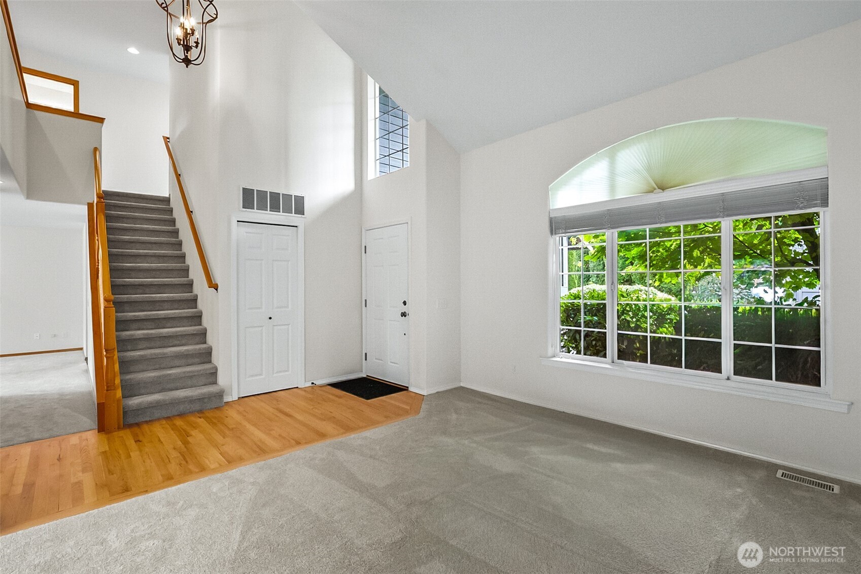 18410 11th Drive Southeast Bothell, WA 98012 - Photo 5 of 40 a view of an empty room with wooden floor and windows